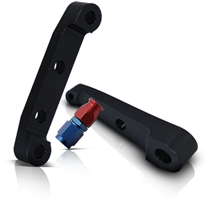 Black aluminum motorcycle brake caliper adapters with colored anodized connector.